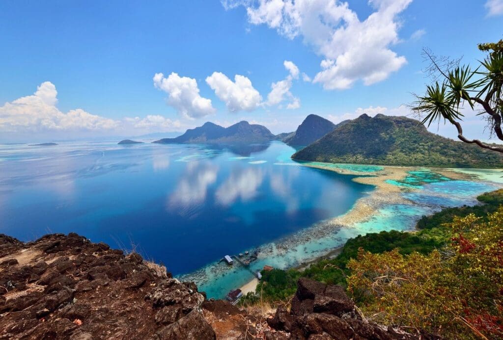 Island vista: turquoise water, lush hills.