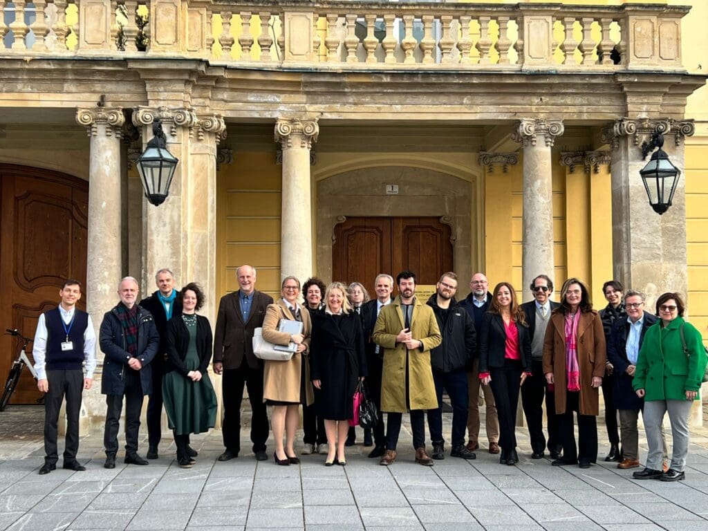 A group of people standing in front of a building.